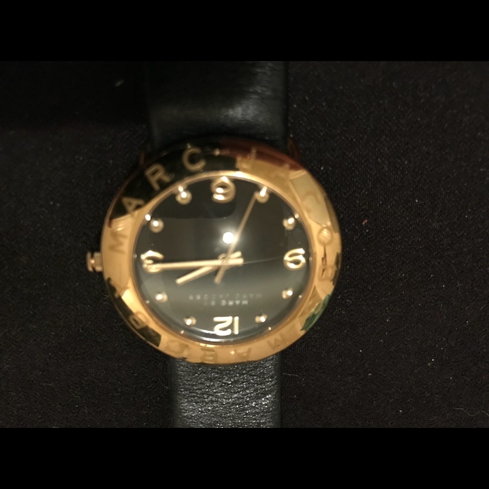 Marc Jacobs gold face and black leather watch